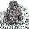 The back of a furry creature with grey, curly texture stands on a textures white background.